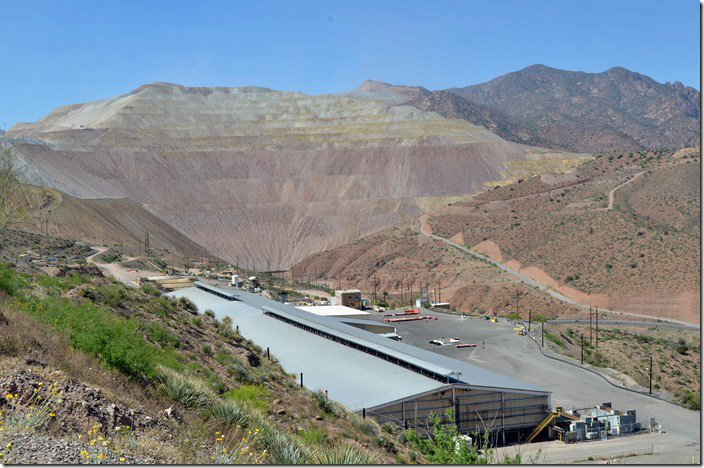 Swinging my camera to the left, we see one of Freeport-McMoRan’s buildings and a hairpin curve on US 191. F-M plant. Morenci AZ.