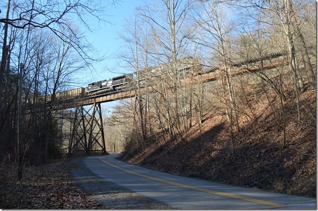 NS pusher 1059-3613 J73 has just gone over the spur to the inactive Amonate Mine. The junction is known as Beech Fork VA. 740 is now on the grueling grade of 1.50%.