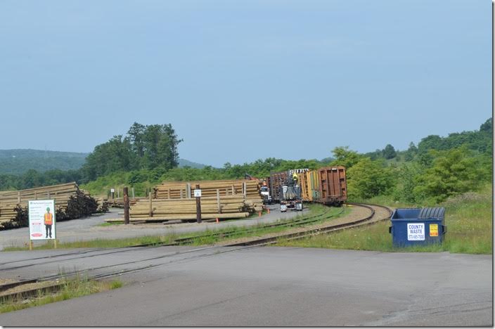 After staying the night in Hazleton, we explored the abandoned Tomhicken / Gowen branches west to Rock Glen. The line ends at this siding just west of I-81 where utility poles are unloaded. This line merged into Pennsy at Gum Run. It has been gone so long that that it is hard to discern where the railroad was. Unloading poles on NS near Hazleton PA.