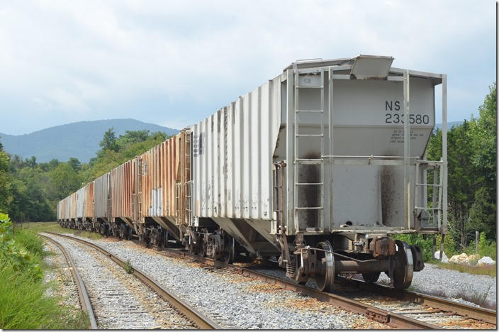 This particular car was loaded with Portland Cement for Selma NC. The scenic branch appeared to get frequent use. NS covered hopper 233580. Lone Star VA.