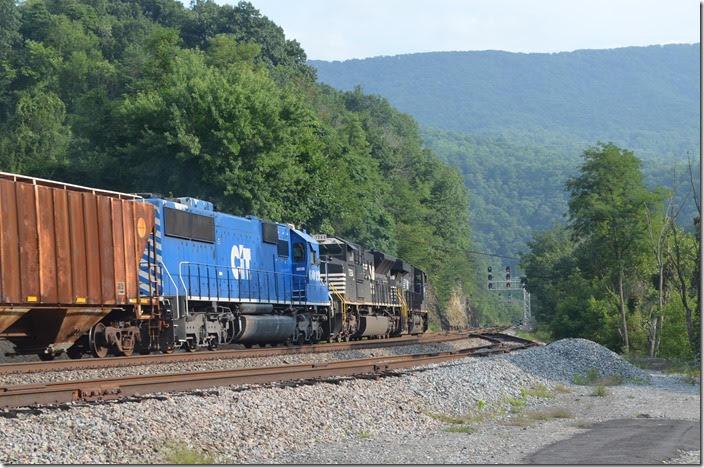 The engineer revealed to the dispatcher that the 6019 had shut down a couple of times, and if it conked out again on the steep grade up to Bluefield they would not make it. The dispatcher said they would have all green signals. NS 8088-7264-CEFX 6019. View 3. Glen Lyn VA.