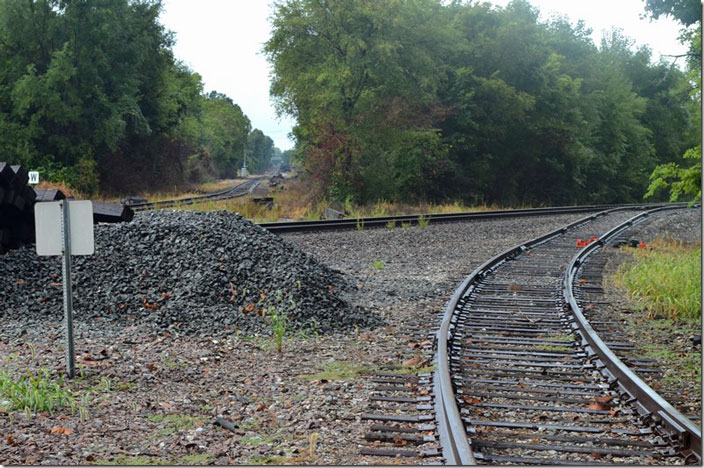 Historically we are looking south at the New York Central’s Danville IL to Evansville IN line crossing the Southern’s Louisville to St. Louis line. Out of sight in the distance the Cairo Branch continued on southwest to the the Mississippi River at Cairo. It was coal originating territory into the Conrail. A large Public Service of Indiana power plant is nearby. Southern took over the line and let Amax Coal shuttle coal trains into the plant from Wabash Mine at Keensburg. Now the mine is defunct, but evidently some coal still uses a small bit of the Cairo Br. and the Evansville line to get into the plant. The crossing has been removed, and the track by my feet is evidently just a spur. In its day the NYC ran “The Egyptian” passenger train over this route to Cairo. NS CB Jct Mt Carmel IL.