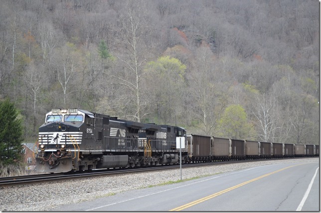 826-10 stopped at Eckman for a crew swap on the pusher. This gave us a few minutes to scout a location. 79M-09 westbound (Clover-Gilbert) passed with 9754-9349 and 99 rapid-discharge empties. This train was billed to “Guyan WV” which is the Coal Mountain mine on the Cub Creek Branch. NS 9754-9349. Keystone.