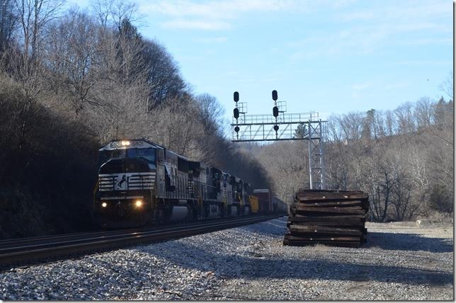 No. 188-03 (Bellevue-Crewe) with 66/23 hustles east behind NS 6801-9249-7508-8781. The electric plant would have been on the right. Bluestone.