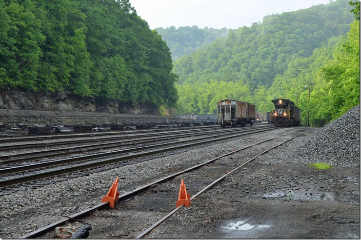 NS U91 with 8791 comes through Wilcoe yard on 05-29-2014 with 55 empties for Road Fork mine at Munson (USC&C #14). West bound. The main line is at a higher elevation on the left.