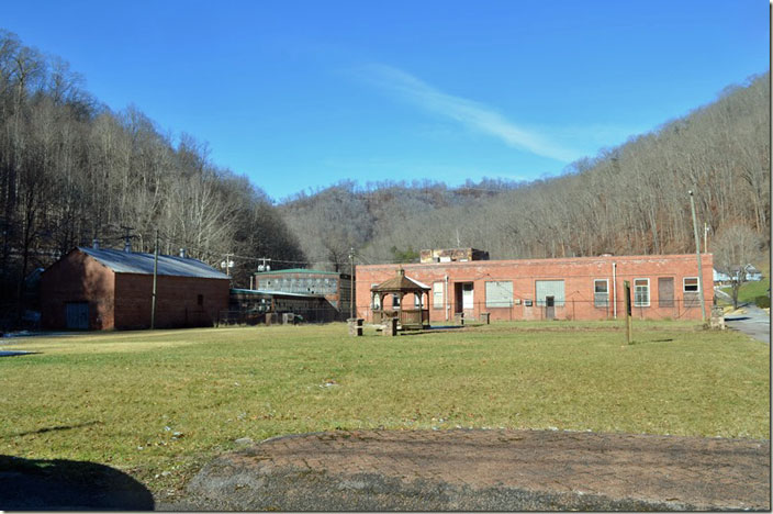 The Coalwood company office building for Carter Coal Co., Consolidation Coal Co., Carter Coal again and lastly Olga Coal Co. On the left is the former machine shop and material store building. YS&T/Interlake/Stelco acquired Carter Coal in 1947. Olga #1 and #2 mines were connected in 1959. The plant shut down, and the N&W’s Clear Fork Br. became largely inactive. The mines however continued at Coalwood until 1982, but the coal was processed and loaded through the mountain at Olga #2 in Caretta. Out of sight to my left would have been the location of the N&W depot. This vacant area was occupied by the huge company store. Coalwood WV.