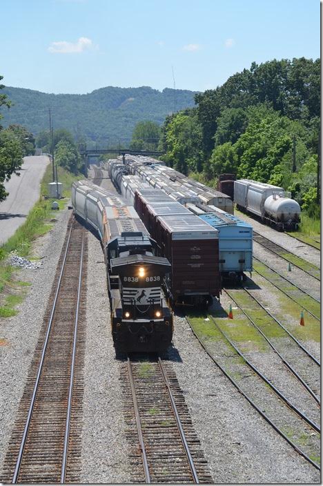 V88 backs south onto the main line. The second bridge in the distance is the former C&O Mountain SD. C&O interchanged at the far end of the N&W yard. NS 8838 Waynesboro.