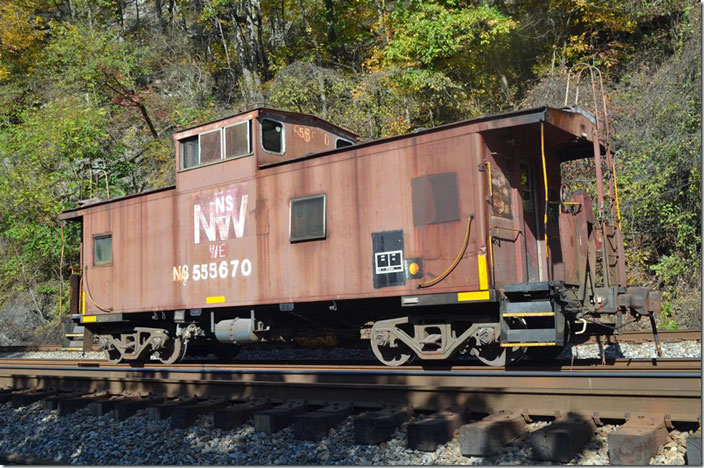 Most of the rest of my shots were taken on a very productive (these days) 11-05-2021 when I took a day of vacation to spend on the Williamson District east of Vulcan. Cab 555670 was parked in the center siding at Vulcan. It had probably been used on a work train or as a pushing platform up the Delorme Branch. Notice the “WE”. Evidently it had been used by the “new” Wheeling & Lake Erie. Originally it was N&W class C31 518670 built 1-1970. Vulcan WV.