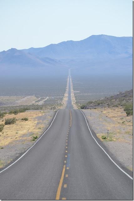 NV 374 looking looking southwest toward the entrance to Death Valley National Park. Road to Rhyolite turns right at bottom of hill. NV 374 west, Rhyolite NV.