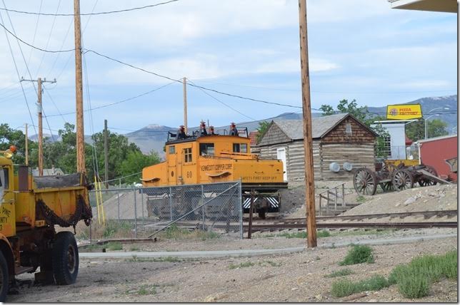 Kennecott used one electric locomotive at the McGill smelter to push loaded ore hoppers into the rotary dumper. It is now on display at a small park in Ely. The park was closed, so I took this shot through the fence. The engine is similar to those used at the Bingham UT pit.