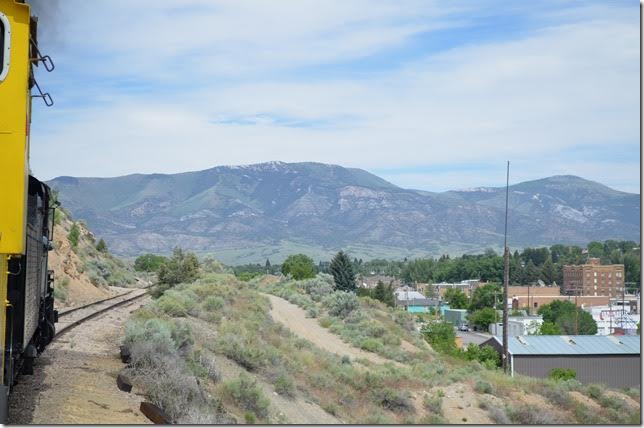 Dropping down the grade of the ore line along the north side of the town. Early on the numerous passenger and ore trains tied up the town so much that this bypass was built. The original line no longer continues through town.