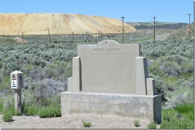 Keystone wye to the left of the monument. The road to Ruth is in the background. The “L” marker signifies US 50 as the “Lincoln Highway.”