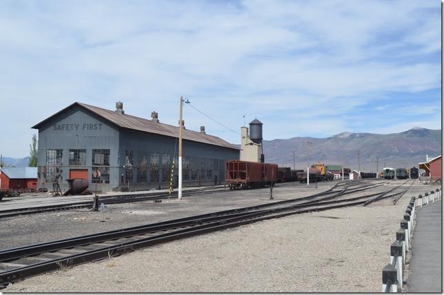 The R.I.P. (repair in place) shop on left and the red freight station on the right looking east. 