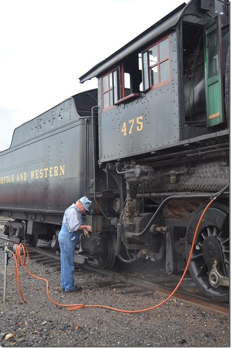 The time honored scene of the engineer with his grip. The engineer and fireman reverse their roles in running the engine.