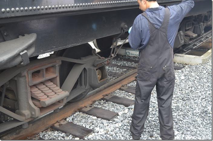 Hostler checking the journal lubrication on 90’s tender.