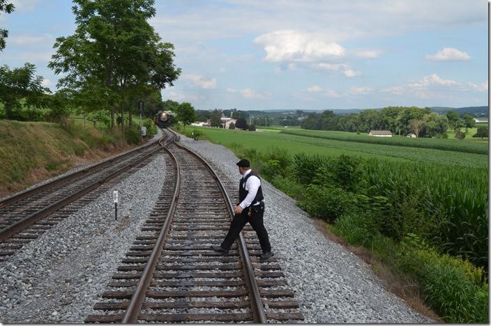 Strasburg Trainmaster Ryan Merrill observing 2-10-0 No. 90 overtaking our mixed train at Groffs Siding (Cherry Hill). Strasburg conductor. Cherry Hill.