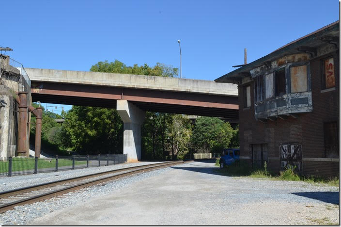 The old N&W main headed up Blackwater Creek to the left of the street bridge pier. This is Southern’s old main line which is now the connection to the CSX interchange around the curve. N&W X Tower. View 2. Lynchburg VA.