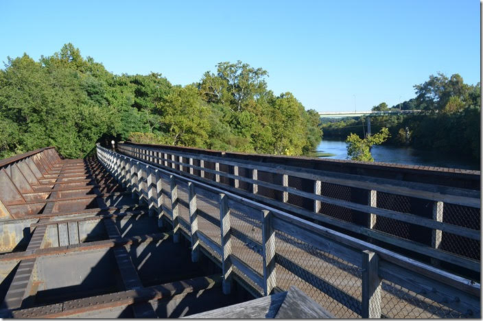 This is a walking/bike trail now. Looking downstream on the James River toward the US 29 Bus. bridge. C&O would be on the right side of the river. N&W bridge. Island Yard. View 2. Lynchburg.