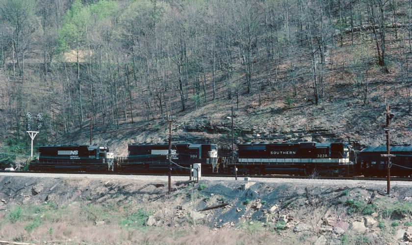Southern 3238-NS 3192-6100 (SD40-2/SD40/SD40-2) have a "Dismal River Crew" at the west end of Weller Yard on 04-15-1986.