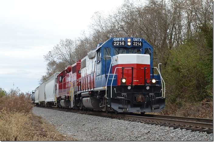 Someone got off this train, and that other Geep disappeared! This train backed east of the crossing and stopped, so I took more pictures. GMTX 2214-RJC 3850. Lexington KY.