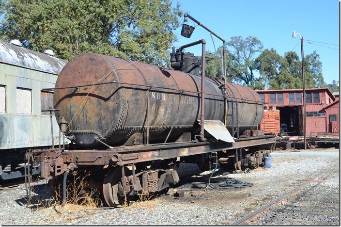 Being a buff of older rolling stock, this ancient tank car got my attention more than anything else on the property. We can see the faint lettering of SRR (Sierra Railroad) 606. I found lettering indicating it was built in 8-1907. “.....Refining Company”, “LA&SGV” and “Do Not Drink” give a few hints. Los Angeles & San Gabriel Valley was a short railroad that Santa Fe acquired many, many years ago in the expanding Los Angeles area. Evidently this car was owned at some time by a refining company which was common for the era. It may have been used to transport water after and before its petroleum career hence the warning not to drink the water it contained. Santa Fe had water problems in the desert southwest, and ran trains of tank cars for locomotive water. SRR tank car 606. Jamestown CA.