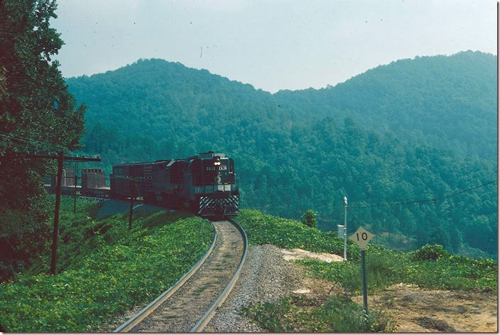 Eastbound local No. 88 behind Southern 2636-5053 negotiates the loops at Dendron around Andrew's Geyser. 09-04-1976.