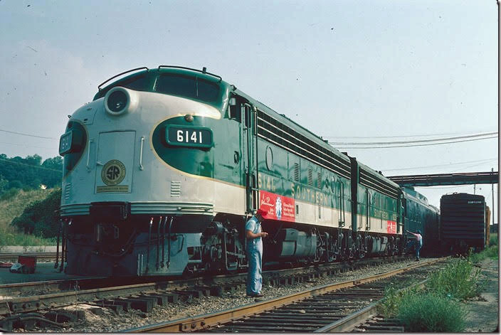 Famed Southern engineer Frank Clodfelter – also an author and photographer – poses beside the Skyland Special excursion after its arrival back in Asheville. 09-05-1976.