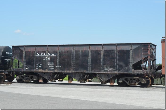 SRR 150 is lettered for the New York, Ontario & Western on one side and D&RGW on the other. In truth, it is ex-NYC or P&LE (shopped McKees Rocks PA, shops on P&LE in 1967). The trucks are embossed “NYC.” Looks like it has been modified to spread ballast. NYO&W hopper 150. Strasburg.