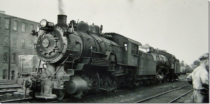 B&O 2-8-0s 3133-3117 at Kane. Both are class E-60 and came from the Buffalo & Susquehanna takeover. No. 3133 was sold to the Wellsville, Addison & Galeton in 1955 when that road took over that portion of the old B&S. No. 3117 was scrapped in 1955. B&O 3133. Kane PA. 1954.