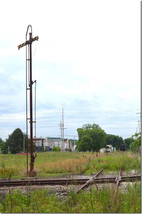 Looking west on the Carrollton Br. toward Minerva Jct. I think those are stored tank cars. WLE crossing signal. Minerva OH.