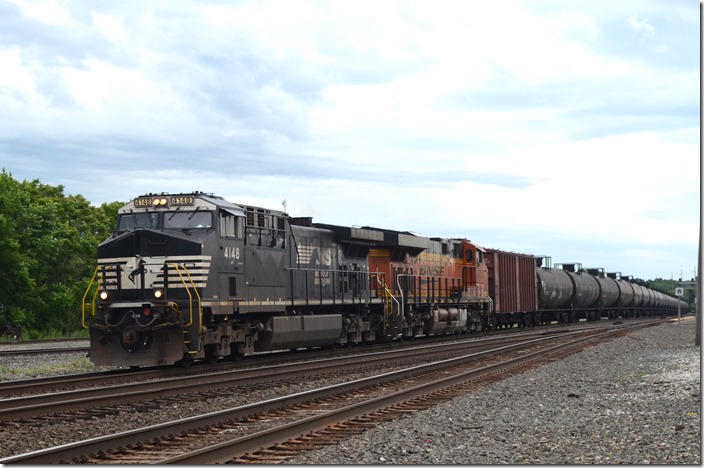 NS 4148-BNSF 8173 head w/b empty oil train 67E-15 (Eddystone PA to Chicago-BNSF). NS 4148-BNSF 8173. Alliance OH.