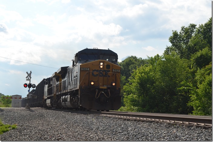 I could see the approaching headlight for a long time. CSX 562-354 rips through with a string of coke empties. CSX 562-354. Niles Jct OH.