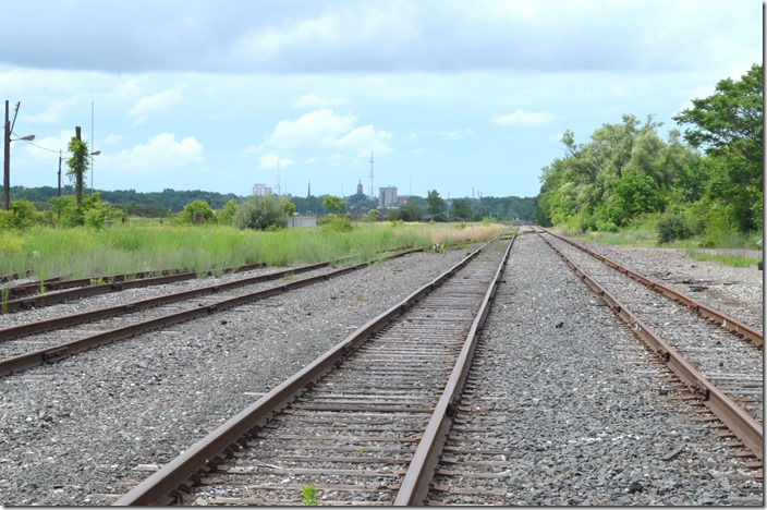 We headed from Alliance to Warren via OH 8 and Newton Falls. It appeared the Erie-Lackawanna through Warren had been ripped up not long ago. We turned on Warren-Niles Rd. following a track that I thought would lead to DeForest Jct., the former B&O yard in the area. I thought the view above was the B&O and E-L. Turns out both of those lines were just a short distance east of this location. This is the NS Niles Secondary formerly known as the Pennsy PY&A Branch (Pittsburgh, Youngstown & Ashtabula). That’s Warren in the distance looking northwest. NS near Warren OH, to the north.