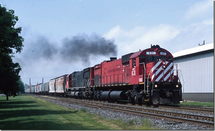 The Montreal M-630s leave town in typical ALCo fashion. This is the former NS, P-C nee Pennsy Buffalo main line. WNY&P 631-637 DFT-2 sb.