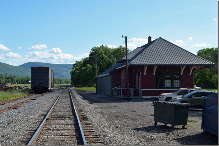 Looking west on the Lycoming Valley RR. LVRR operates over former NYC and Reading track from Avis through Williamsport to Montgomery. They are another one of the six North Shore Railroad Co. affiliates. Former Chessie HLMX boxcar 491545 is parked on the left. LVRR Avis PA yard depot. 06-23-2021.