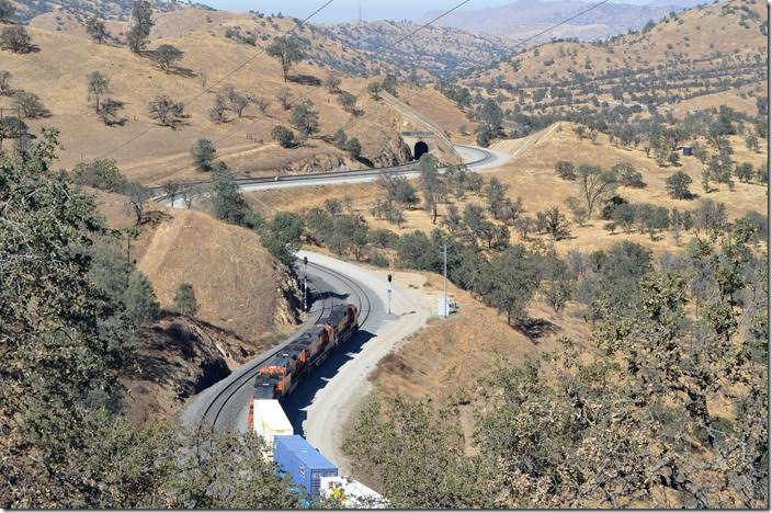 Westbound BNSF 5489 drops down grade at Tunnel 10. The recent construction by UP to the right of the tunnel enabled Walong and Marcel sidings to be connected.