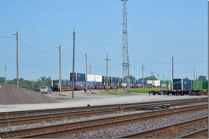 As a double stack is switched, the jitney follows the conductor. UP 8625. Dupo IL.