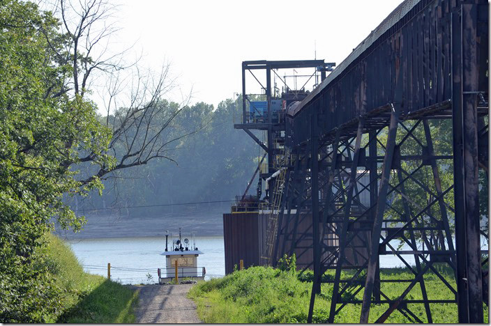 Tug boat for moving barges. 4,000 tons per hour can be dumped from storage to barges. Cora IL. Watco coal terminal.