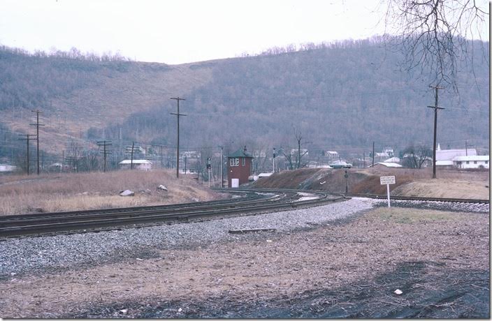 Herb Parsons and I drove over here following our WMSR tour. Everything is gone except the wye which WMSR still uses. All of this has been reclaimed by nature. This view looks railroad east at Maryland Junction tower. The main line to Hagerstown swings to the left and under the mountain through Knobley Tunnel. The track to the right goes west a short distance to Knobmount Yard on the Elkins line where the coal was classified. WM Ridgeley WV.