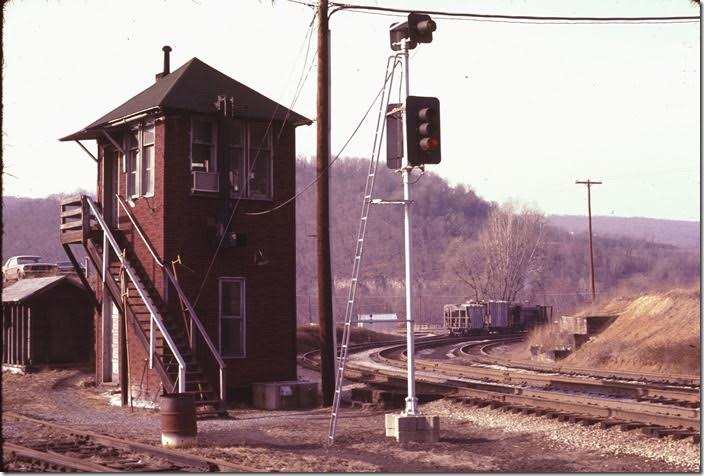 “MY” controlled the junction. We talked to the operator for a while. He said an eastbound freight would be departing soon. We talked some more and finally left for a shot at the east portal of the tunnel. We had to go back through congested Cumberland and south on Virginia Avenue past the B&O shop to get to the east end of the bridge. WM Ridgeley WV.