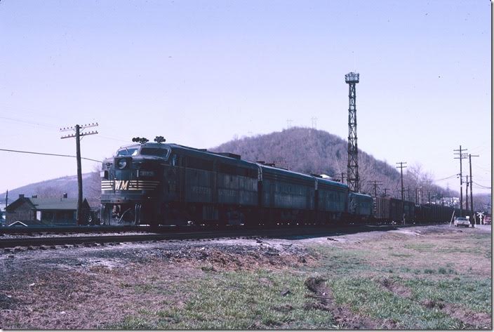 ALCo FA-2 303 with F9b 413 and F-7a 51 have cut off from a westbound freight and will head to the engine terminal. WM Ridgeley WV.