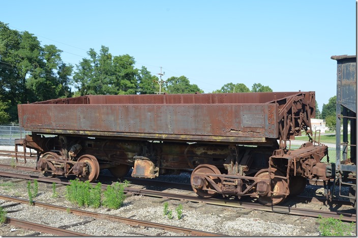 This ancient dump car had reporting marks MCC or MCQ as best I could tell. It probably belonged to an industry. MCC or MCQ dump 7. Connersville IN.