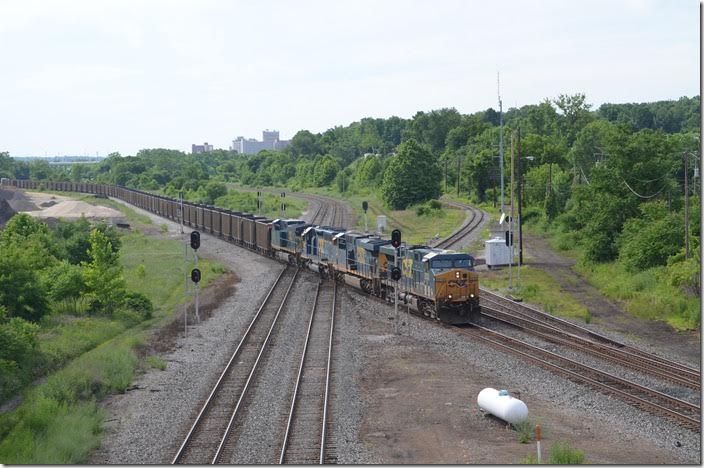 The Center Street bridge has been rebuilt. Yes there is wire, but railfans have cut holes in good places for photos! There are sidewalks on both sides, but the traffic can be heavy. There are places to park off the bridge on the Campbell (north) end. CSX Q348 rolls east behind 5238-752-8456-49. This appeared to be a loaded sand train in PMRX hoppers combined with the manifest. It was 190 cars!! The dispatcher informed Q348 that they didn’t have to pick up at Ohio Junction, the local yard. I was relieved at that news. Republic Steel’s mill was at the left edge of this photo. CSX 5238-752-8456-49. Haselton OH.